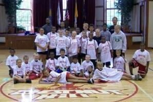 Children posing for a photo in a gym.